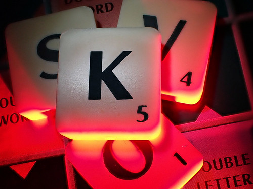Scrabble pieces red glow | by Julie Camera Vause. NZ