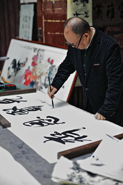 Chinese calligrapher practicing his calligraphic skills-Shuyuanmen Ancient Culture-Calligraphy Street. Xi'an-China-1570