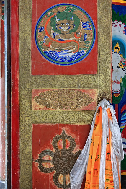 Red wooden door-golden ornate-protector dragon-lotus flower on Buddhist vajra. Shengguo Temple of Mati Si-Horse Hoof Temple-Zhangye-Gansu-China-1025
