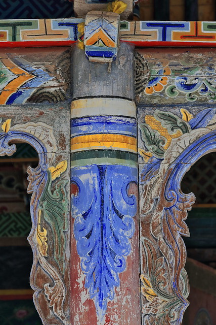 Detail of polychrome decoration-fine woodcarving-roof supporting column-entrance porch Shengguo temple of Mati Si-Horse Hoof Temple. Zhangye-Gansu-China-1024