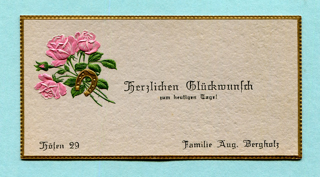 Glückwunschkarte mit Rosen und einem Hufeisen