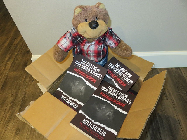 Teddy Tedaloo with The Best New True Crime Stories: Partners in Crime author copies