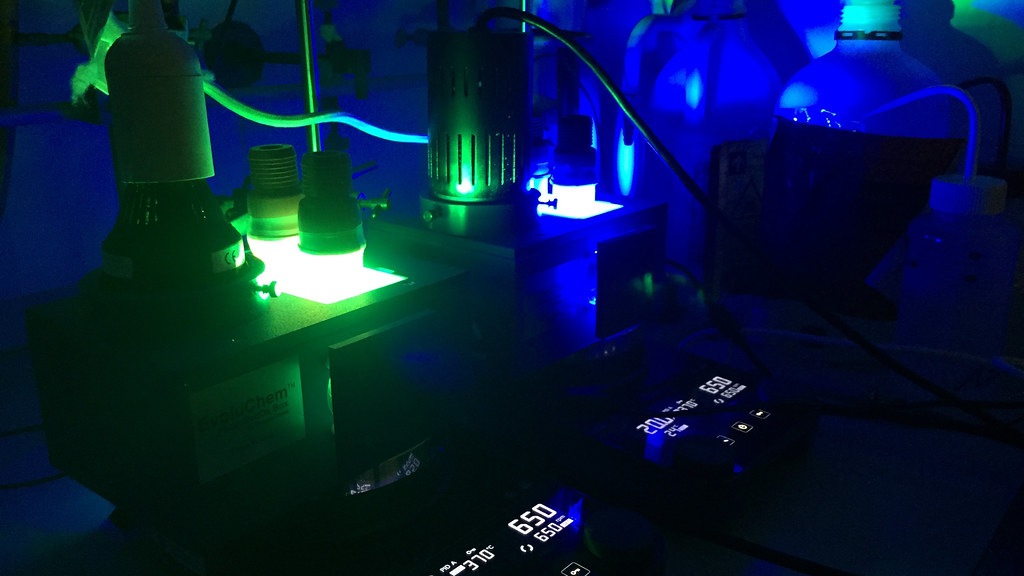Chemistry lab equipment lit with a blue LED light