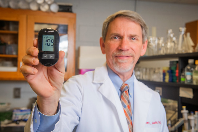 Robert Judd displays a blood glucose meter.