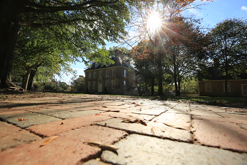 Beyond the brick walkway is the Brafferton, home to the Office of the President of William & Mary.