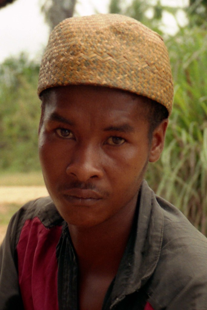 Man in Palm Hat; Road S of Manarara, Madagascar