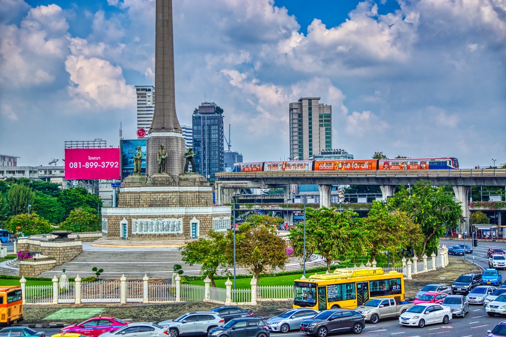 BTS Skytrain passing Victory Monument in Bangkok, Thailand