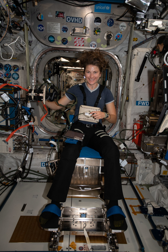 Astronaut Kayla Barron sits in a specialized chair for the GRASP experiment