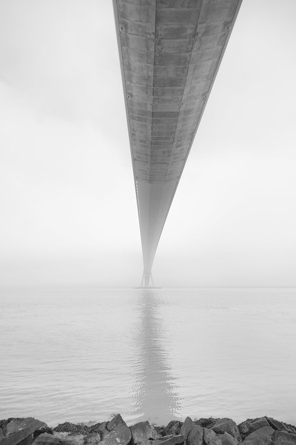 No! it won't fall - base of the the Pont de Normandie, near Honfleur, Calvados, Normandie (Normandy), France, looks insubstantial in the fog. fine art black & white