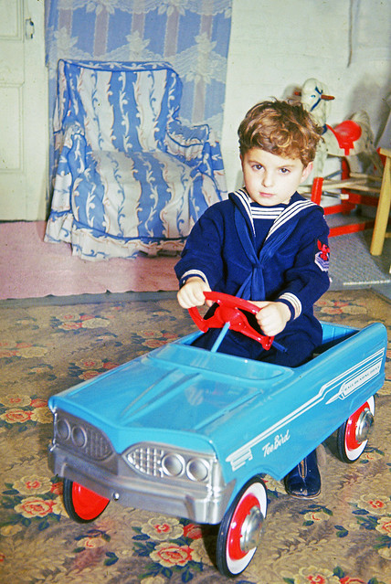 Yours Truly cruising the basement floor in a BRAND NEW 1963 Ford Tee Bird. For forgotten reasons, Mom made me wear a sailor suit before Dad shot this Kodachrome slide. I've had only two Fords in my life. This one and a used '72 Pinto. Milford CT. Dec 1963