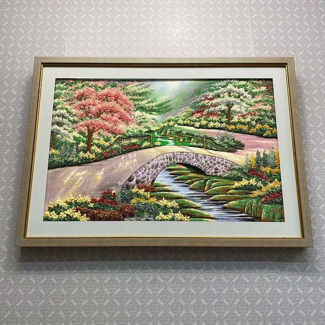 This bucolic scene was created using thousands of gemstone bits! We treated it as we do friable art (like pastels or charcoal) to anticipate losses over time. Displayed in Larson Juhl’s “Waterwoods” moulding line with gold enhancer, Crescent mat, and TruV