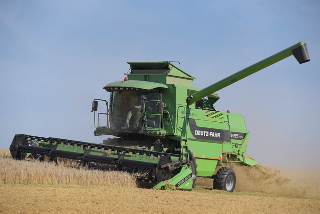 Deutz Fahr 5695 HTS Combine Harvester cutting Spring Barley
