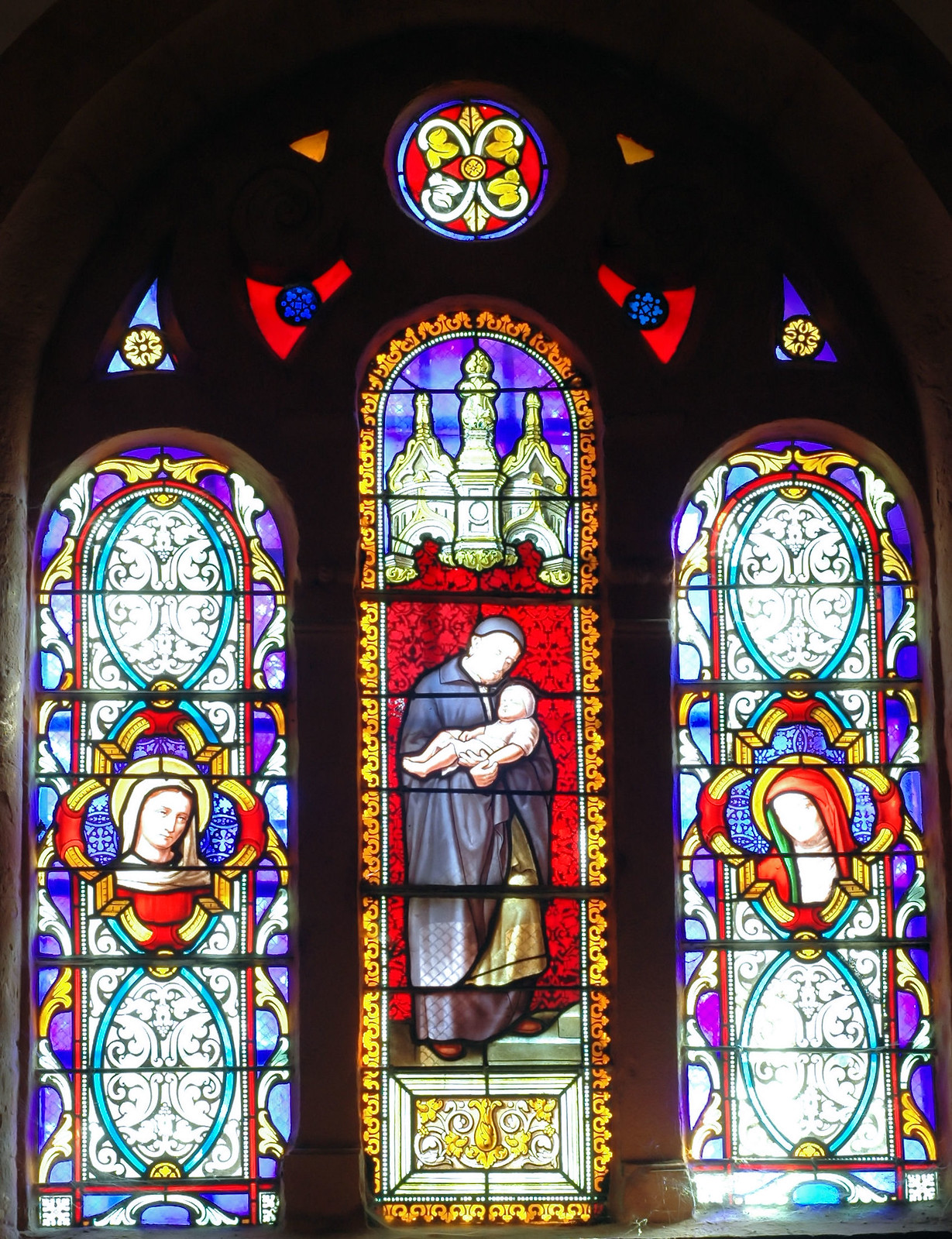 Vitrail de l'église d'Orgelet représentant Saint-Vincent-de-Paul