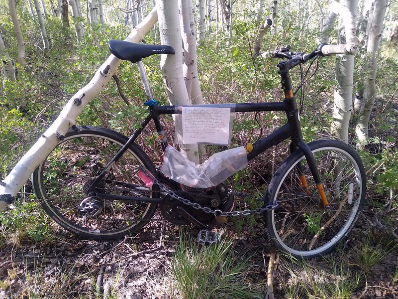 I locked my eBike in the aspen grove above the backpacker parking at North Lake and left a note to please not steal it