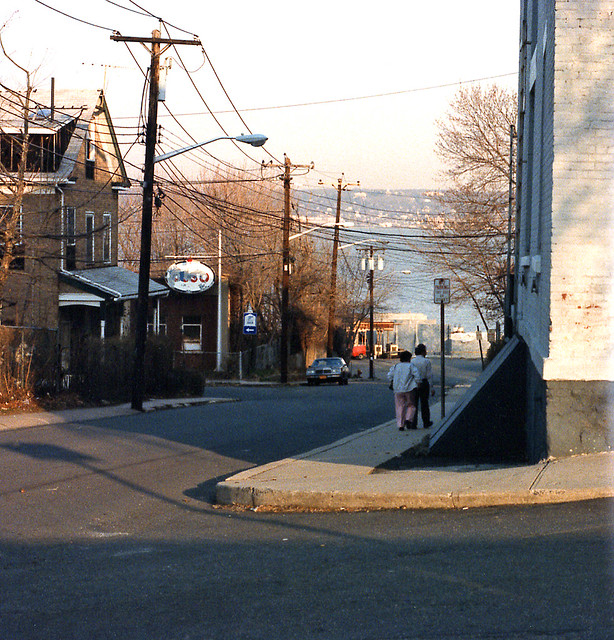 Places no more. An old neighborhood which is only a memory now. Developers bought about five acres in 1986 and built large modern pink cubist waterfront condominium towers near the Hudson River. Nyack New York. March 1984.