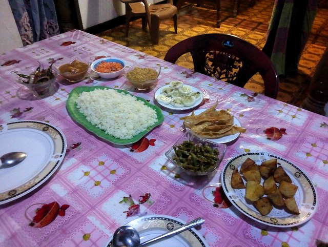 chicken with kızartma-style veggies, mango curry, pol sambal, dhal, cucumber, papadam, green bean curry, potatoes by bryandkeith on flickr
