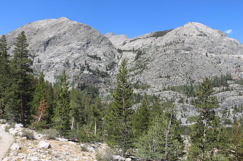 Mount Henry (12196 feet) peeks out between two glaciated granite domes above the South Fork San Joaquin River