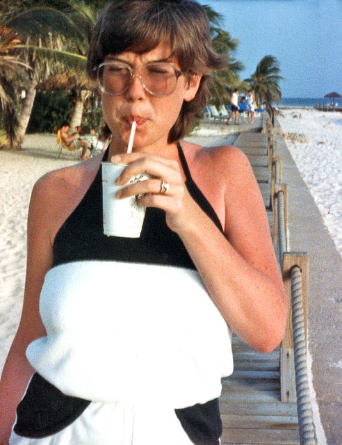 We were so young! My newlywed wife on our honeymoon in Aruba holding a drink. In June, the place is unbearably hot and humid, although the Trade Winds make it tolerable. One of the last photos I ever took with that Pocket Instamatic 40. June 15 1985.