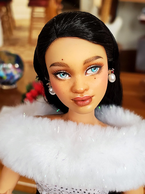 Catalina...  Her earrings are by Franklin Mint, for a 16 inch doll, but I can't remember which one - could be Jackie Kennedy or Princess Diana.