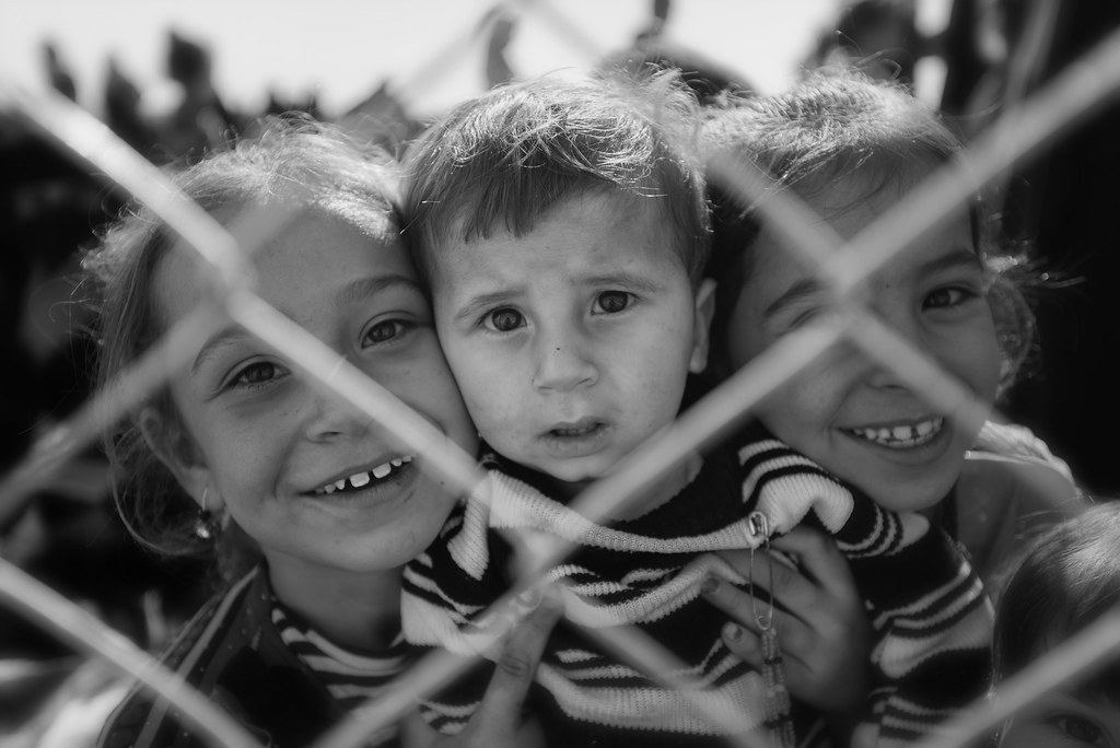 Kids arriving in a refugee camp after years of war
