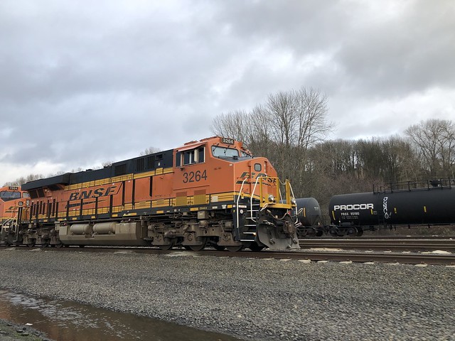 Parked locomotives at South Seattle: pool power, a warbonnet, and a faded Dash 9