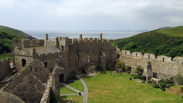 Crenellated stone walls at the 11th century Manorbier Castle in Wales