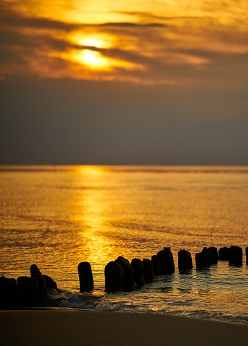 poland europe sunset sun sky baltic sea sand beach breakwater evening