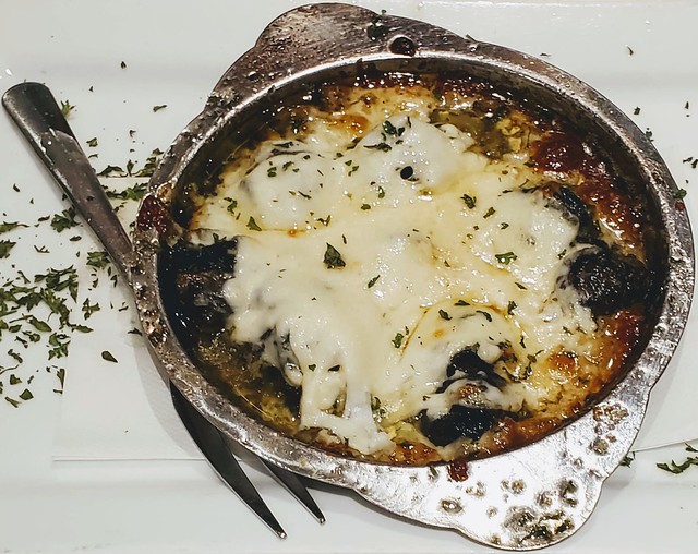 Escargots, in garlic butter, covered in cheese