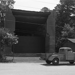 An old building that crumbles and my old truck that soldiers on. A street corner in the small town of Sherman, Mississippi pictured with a lumbering, ponderous old truck that I love.

1949 Kodak tourist with the 3 element Anaston lens on Ilford Delta 100 film.  

Developed in Ilford ID-11 stock solution at 68F, scanned on an Epson V550 using the standard negative carrier with a chunk of anti-newton ring glass on top to hold the negative flat.