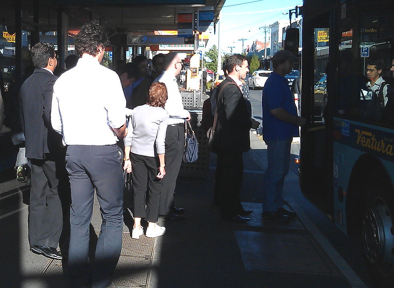 People waiting to board a bus at Bentleigh station (December 2011)