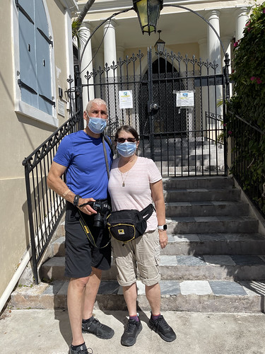 Sandy and Ira Bornstein outside historic synagogue entrance. From History Comes Alive at The Hebrew Congregation of St. Thomas