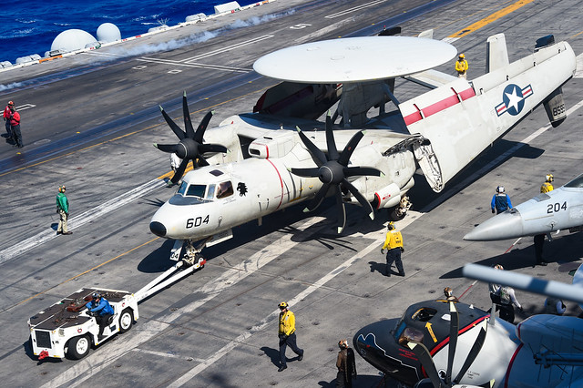 An E-2D Advanced Hawkeye is moved across the flight deck aboard USS Carl Vinson (CVN 70).