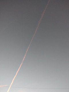 Contrails illuminated by the setting sun, 12/02/2021.