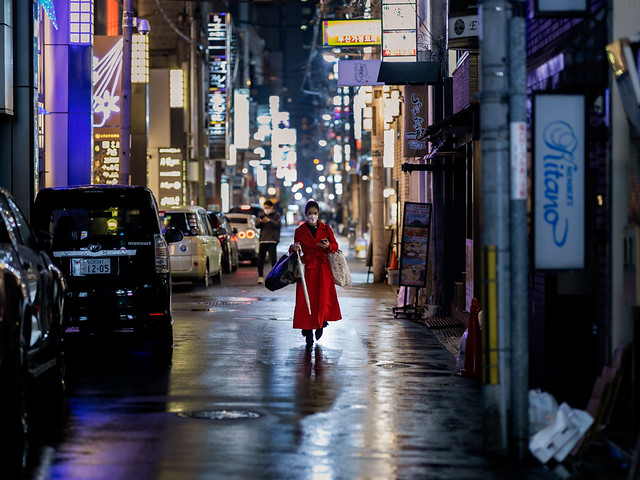 a lady in a red coat