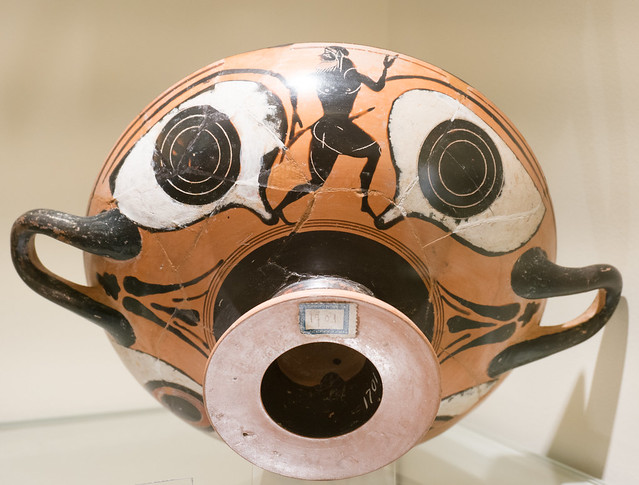 Athenian Black Figure eye-cup with running ithyphallic satyr