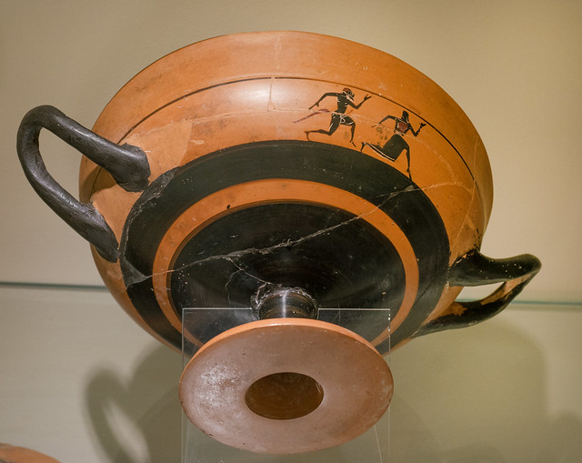 Athenian Black Figure little master lip cup (kylix) with a satyr pursuing a maenad