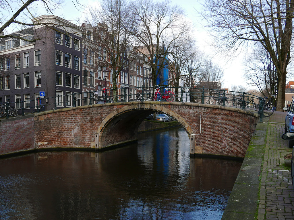 Old bridge over the canal water of the Prinsengracht; free photo Amsterdam,