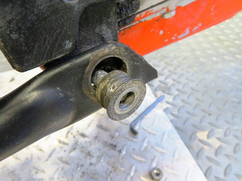 Center Stand Bushing Removed To Allow Bolt To Tilt Down So It Will Slide Past The Oil Pan