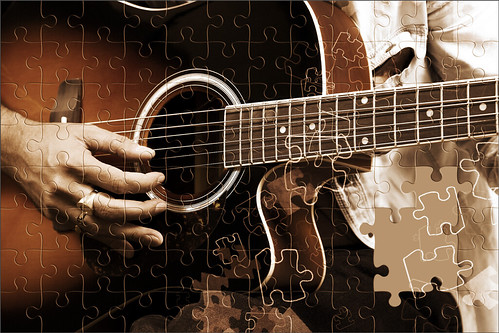 Image of an electric guitar player from Pixabay with puzzle effect applied