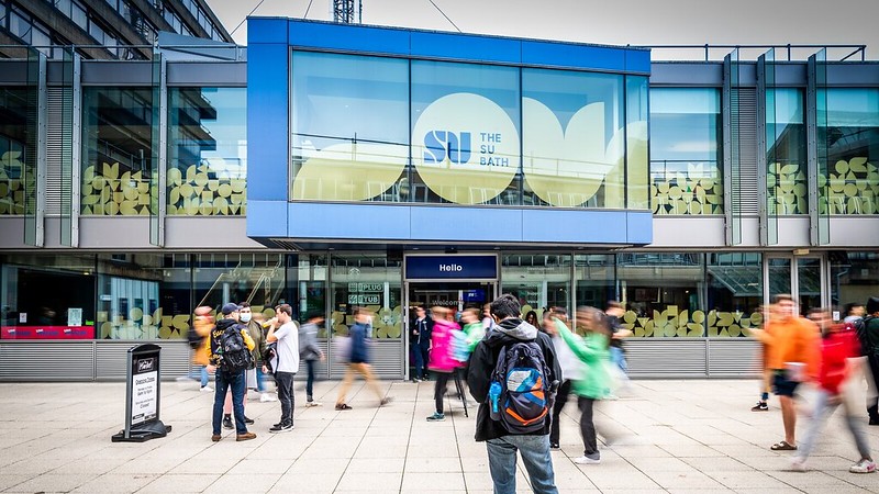 Students walking past the Students' Union (The SU) building.