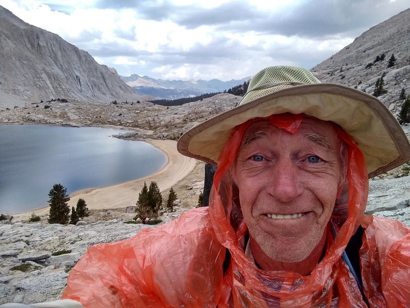At Upper Crabtree Lake, the rain started sprinkling lightly, so I covered my backpack and got out my cheap poncho