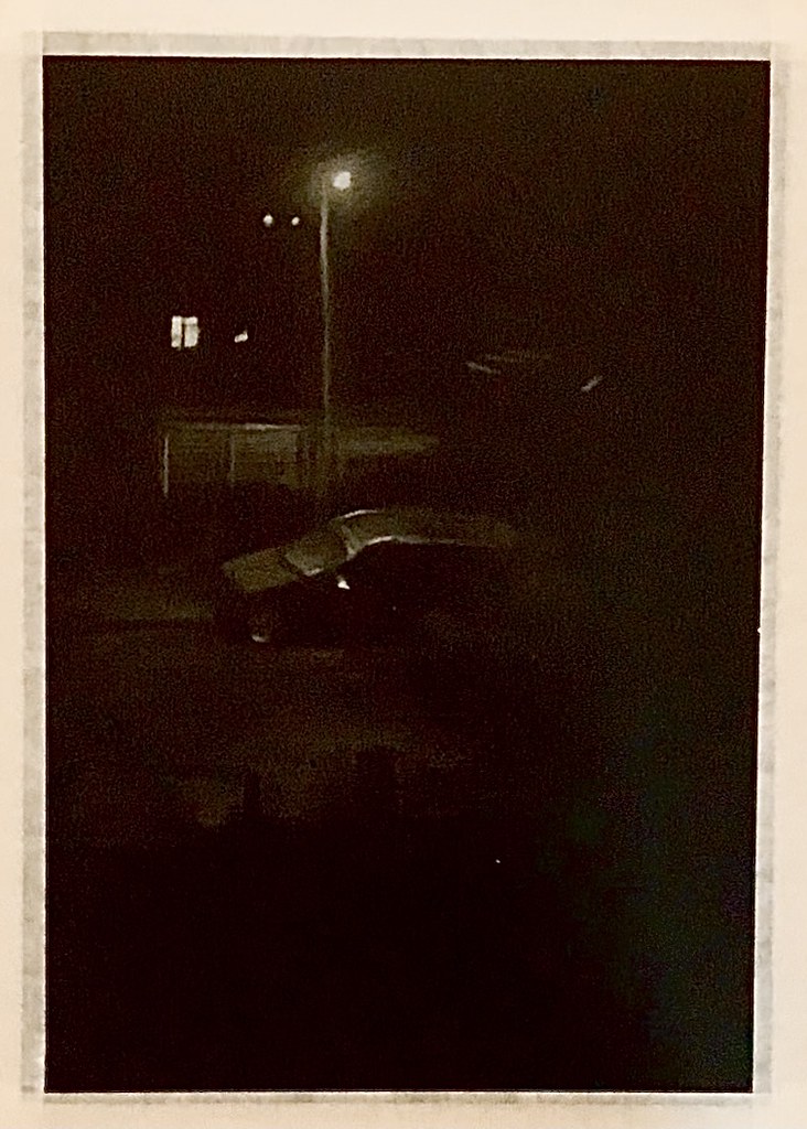 Experimental Art. Night scene. Car parked under a Street Lamp. Polychromos pencil drawing by jmsw on black card.