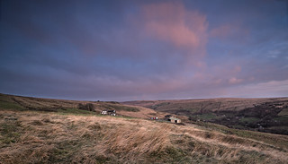 Dawn light on clouds over Buckstones Rd across Hades Farm and Haigh House near top of old pack horse track Pule, Marsden.