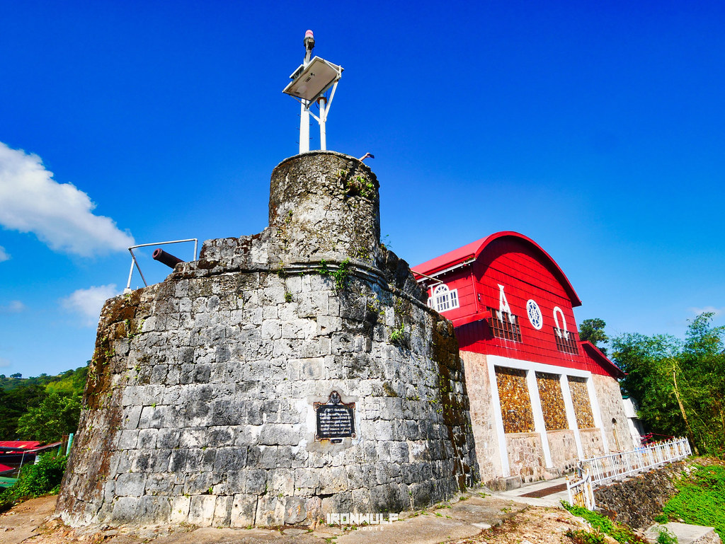 Back of Culion church with the seal, watchtower and canon.