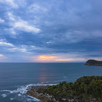19. Detsember 2021 - 5:42 - Aerial sunrise seascape and rain clouds at Pearl Beach on the Central Coast, NSW, Australia.