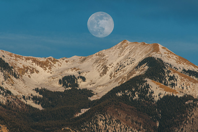 The Full Moon Rising over the mountains