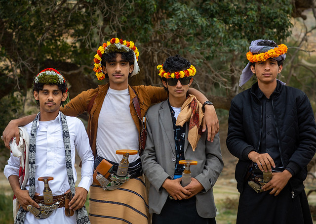 Portrait of flower men wearing floral crowns, Asir province, Sarat Abidah, Saudi Arabia