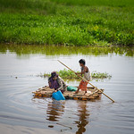 Villagers crossing the river using a makeshift raft in Mingaladon Township, Yangon, Myanmar