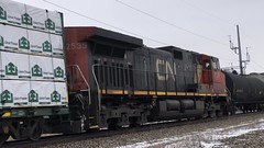 1/22/22 11:35 17 windyvdegrees at CN MP 203.5 as CN 3100, CN 2576, and DPU CN 2535 power Train 302 past the signal on the high bank. Full 2:42 video:
