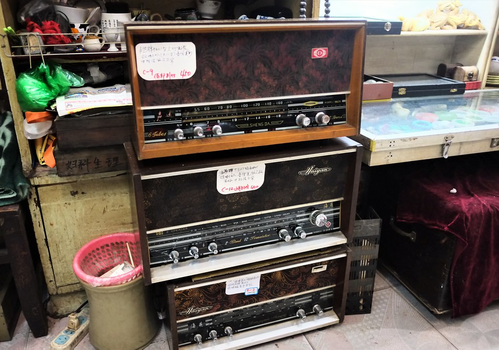 China Wuhan late 2019 flea market seller with big radios awaiting takers - 